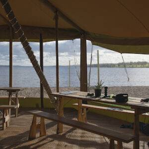 A wedding tipi overlooking a lake