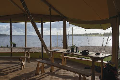 A wedding tipi overlooking a lake