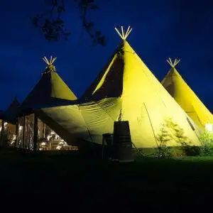 Tipi Lit up at Night in Yellow