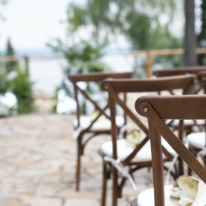 Wooden Crossback Chairs at a Wedding