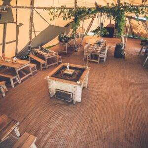 Tipi party interior with fire pit